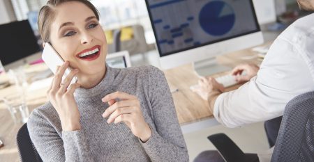 Woman booking meetings with customers by the phone